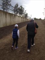 Lachlan and his Grandfather walking home to the stables after trackwork this morning